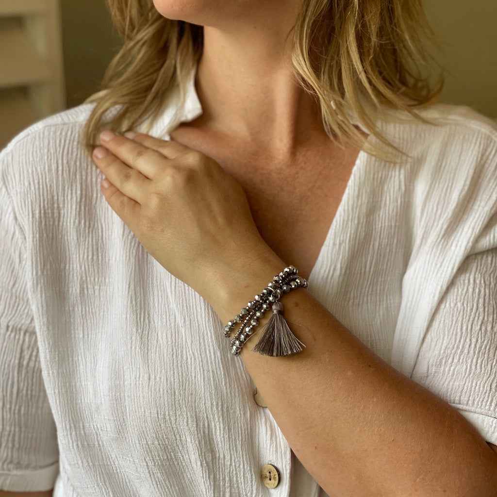 Triple-Strand Crystal Bead Bracelet With Tassel