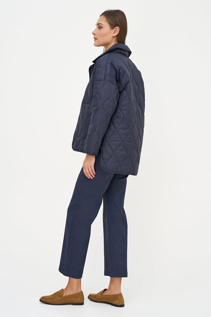 Women's Quilted Long Sleeve Jacket, with Front Patch Pockets & a Snap Closure System. Adorned with a Beautiful Snake Printed Lining