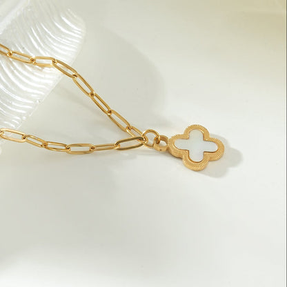 MAKA Gold: Clover Shaped Charm in Natural Shell & Gold Metal Border on a Paperclip Chain