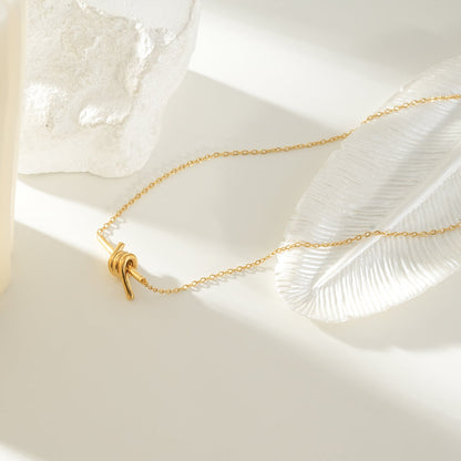 LARISA Gold: Bar Pendant Necklace with Knotted Symbol Detail